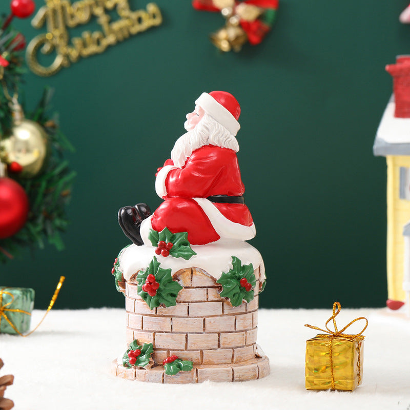 Santa Claus sitting on the chimney resin ornament