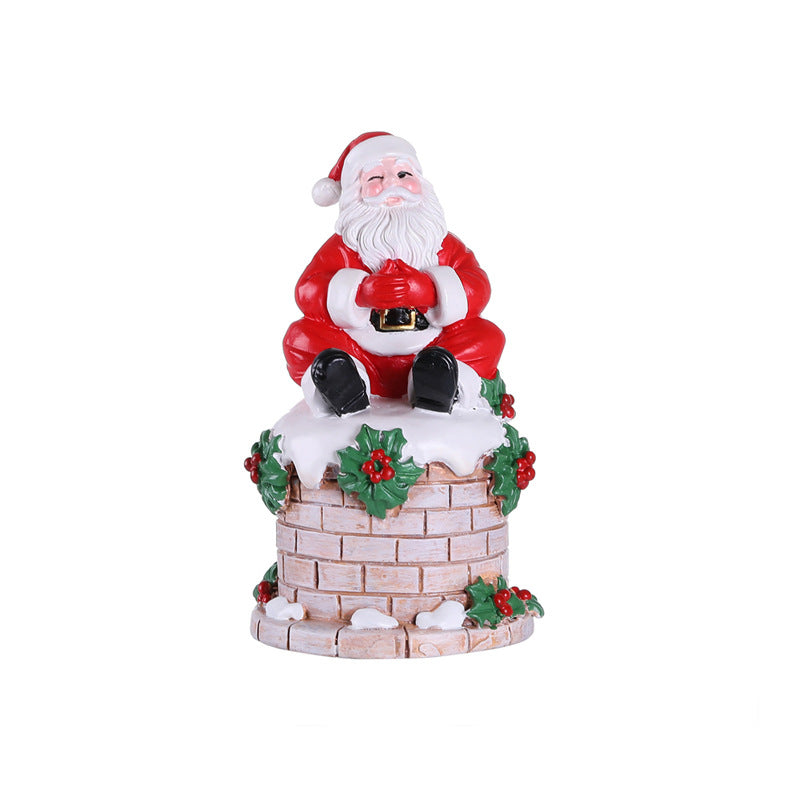 Santa Claus sitting on the chimney resin ornament