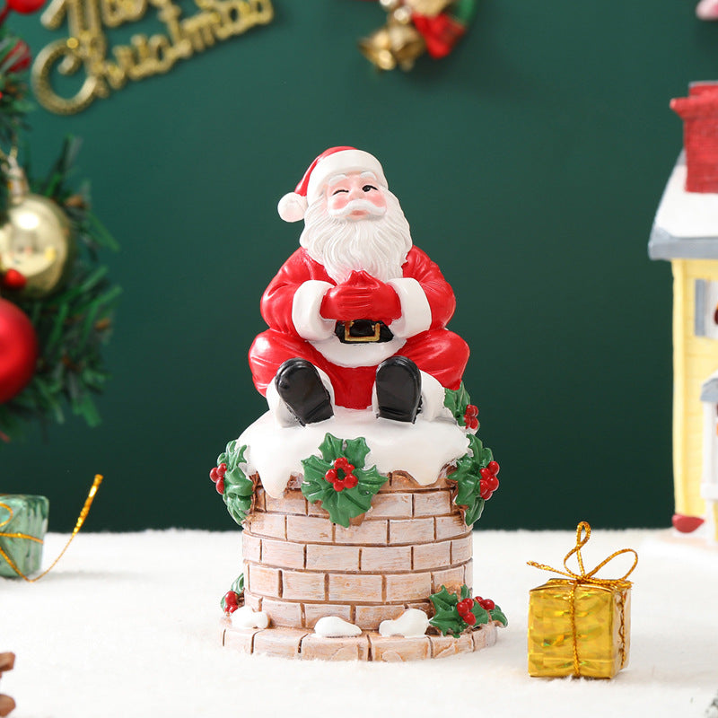 Santa Claus sitting on the chimney resin ornament