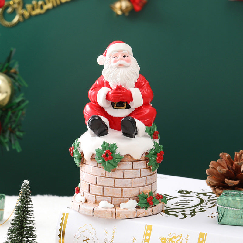 Santa Claus sitting on the chimney resin ornament