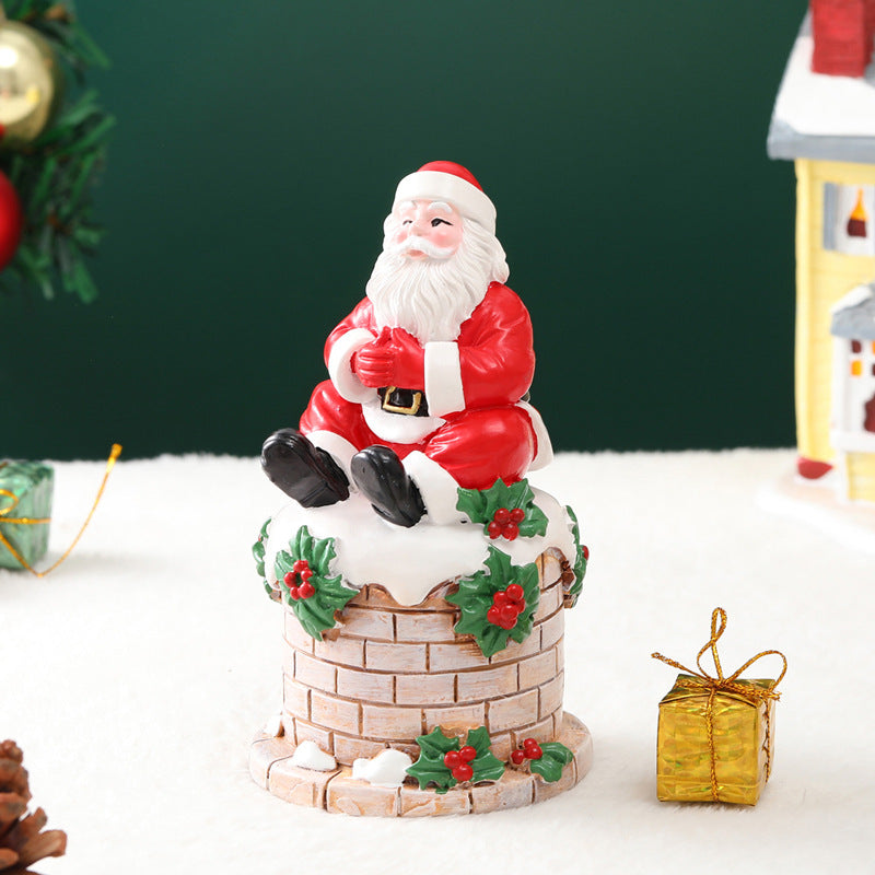 Santa Claus sitting on the chimney resin ornament